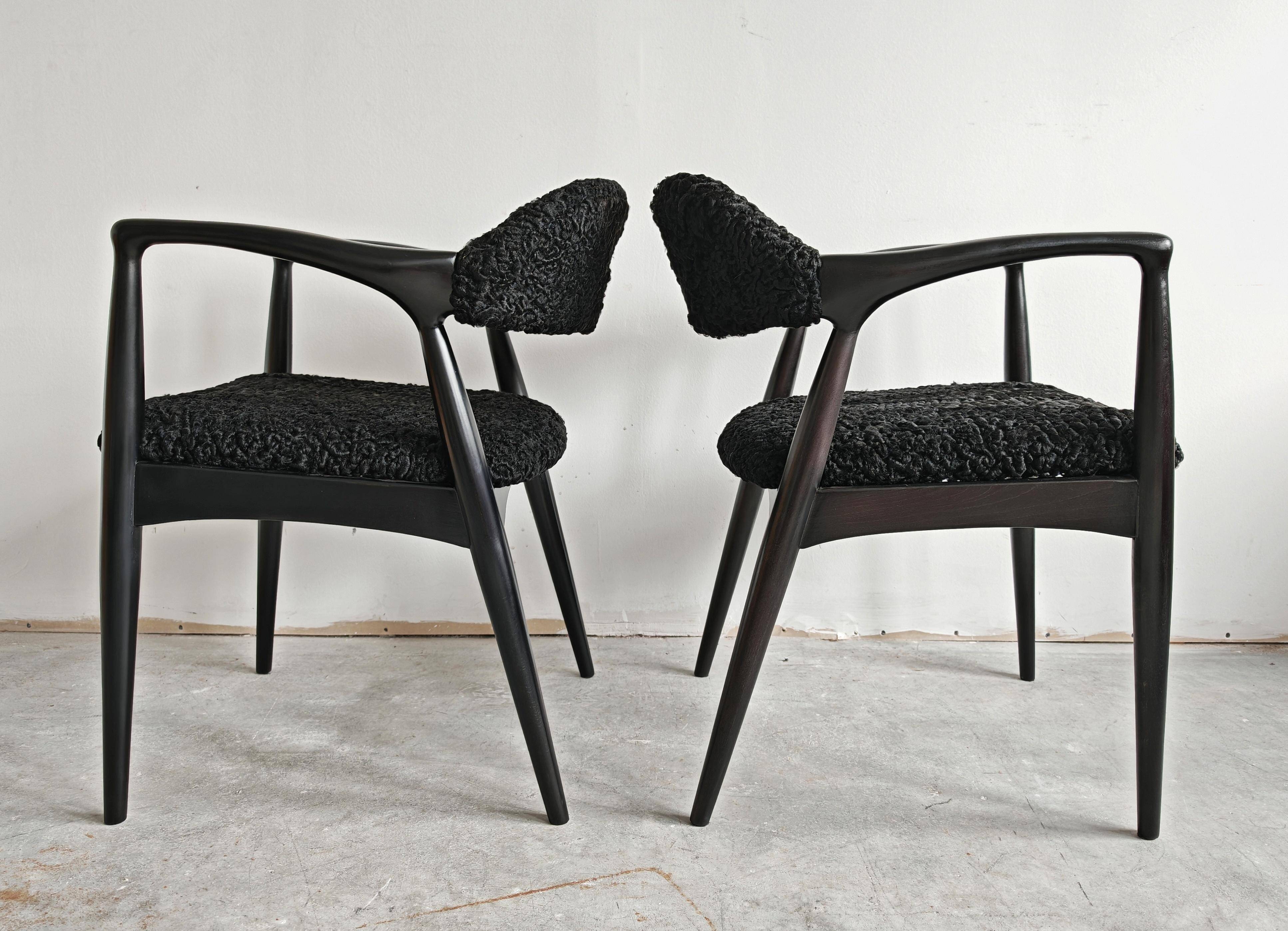 Pair of Mid Century Modern armchairs in astrakhan leather.