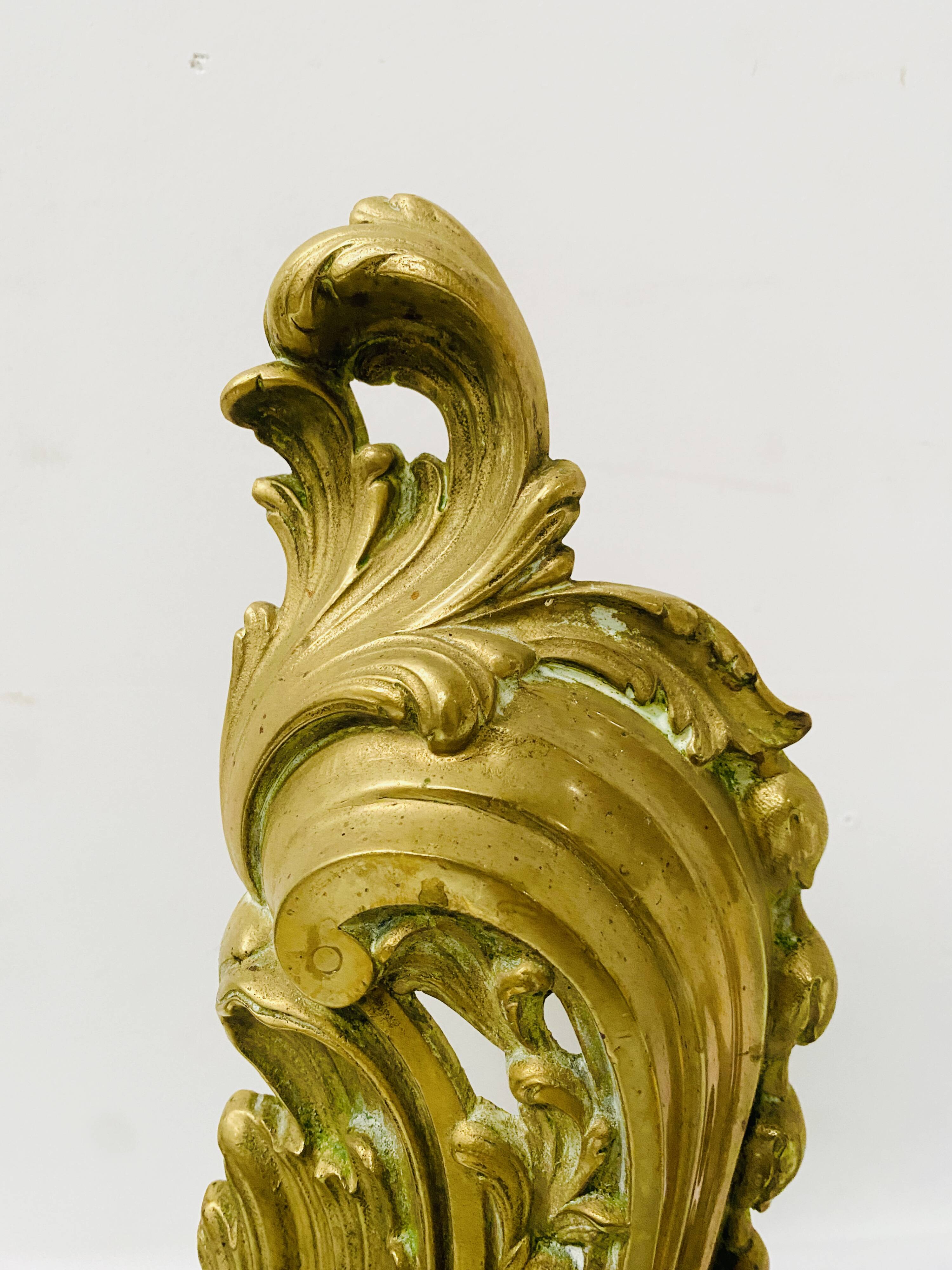 Louis XV style chiseled bronze firedog, 20th century