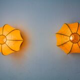 Pair of circular "cocoon" wall lights, resin and pine, Italy, 1970