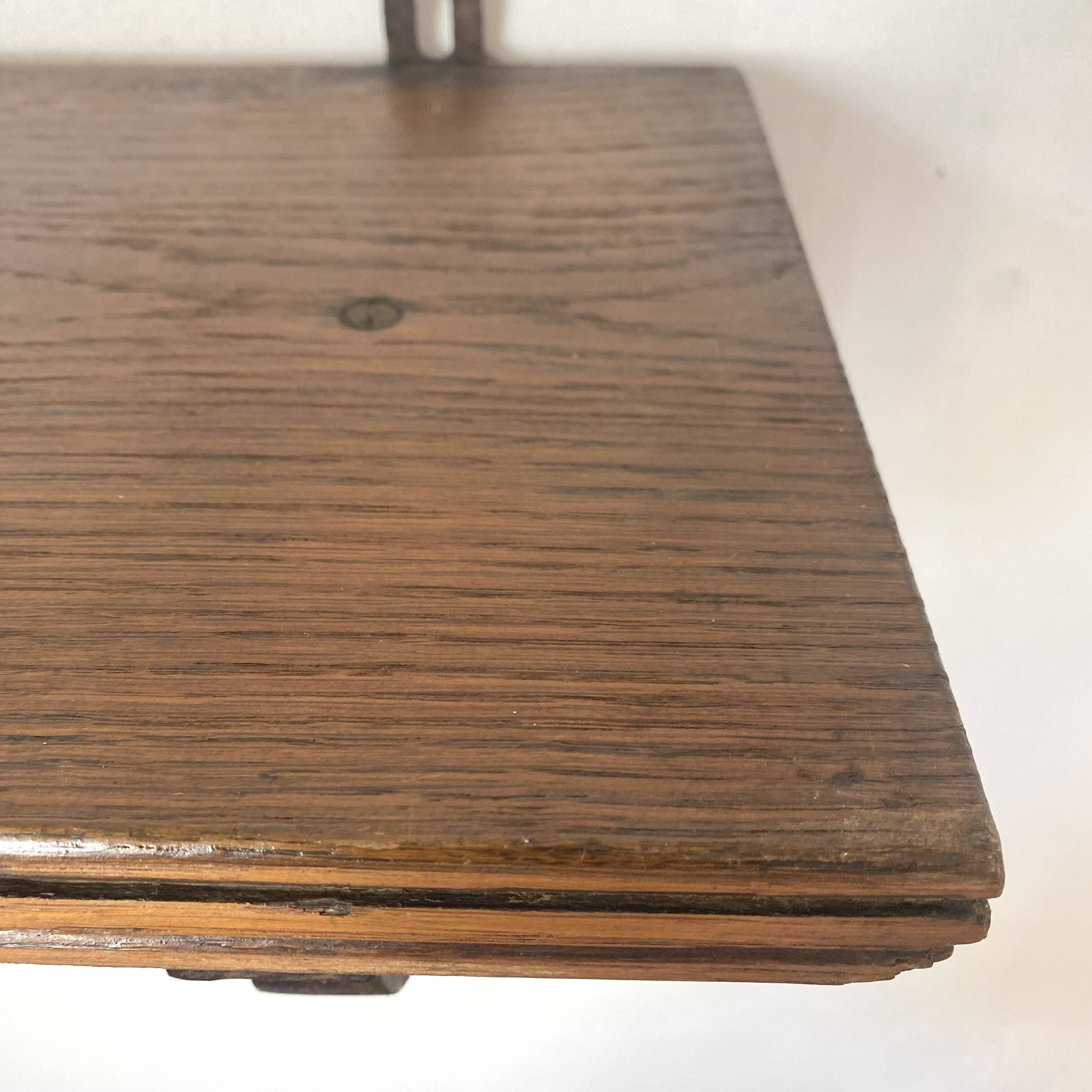 antique oak wall shelf with carved brackets