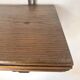 antique oak wall shelf with carved brackets