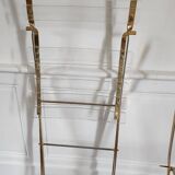 Folding chairs with gold metal structure and methacrylate slats seat and back.