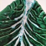 Vintage green slipware bowl in the shape of a cabbage leaf.