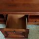 Louis Philippe style coffee table in cherry wood with large drawers.