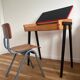 Vintage 1960s school desk with a red Formica top.