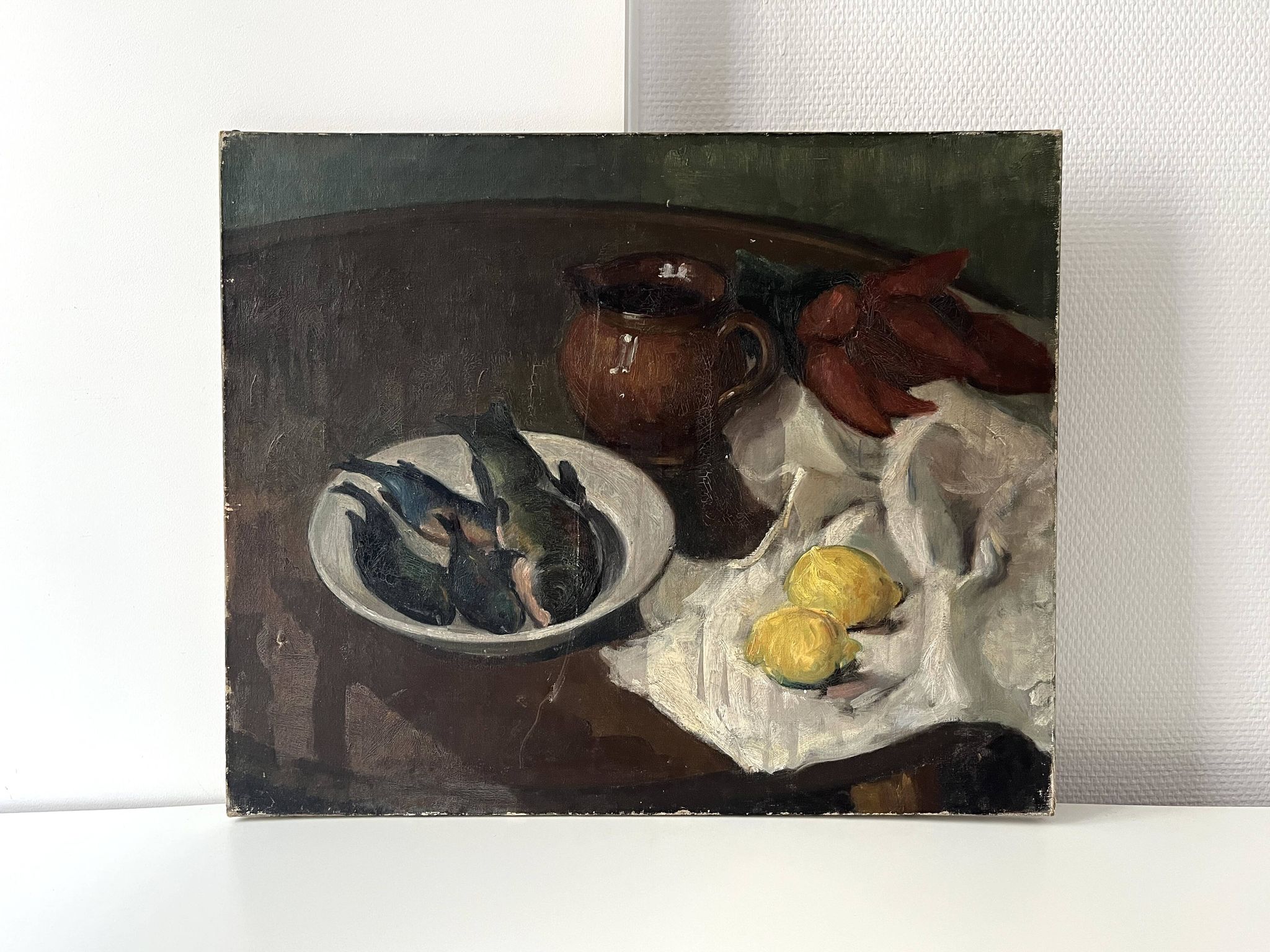 Oil on canvas still life with fish from the 1920s, antique painting.