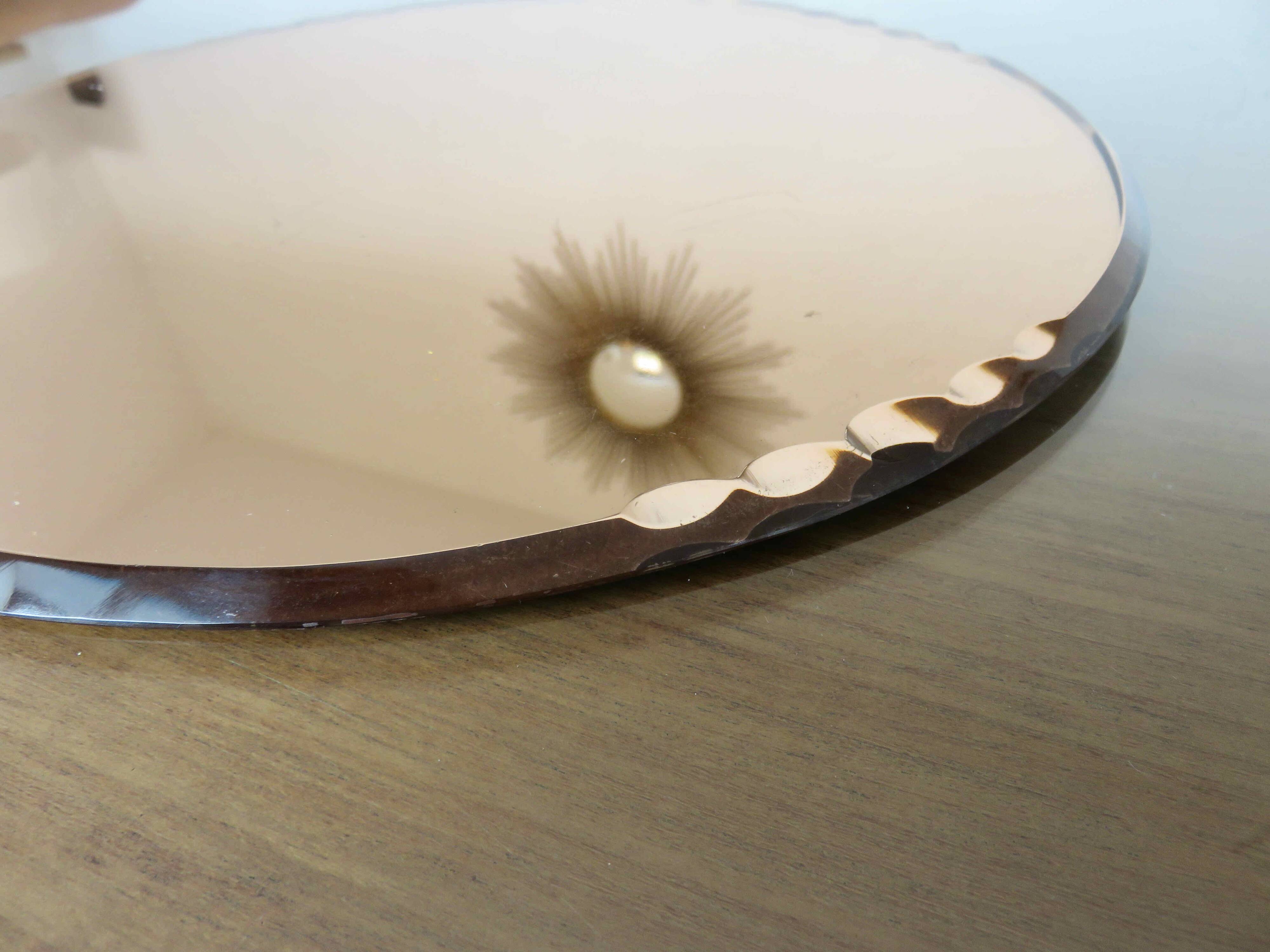 Round beveled amber pink mirror