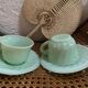 A pair of antique opaline coffee cups.