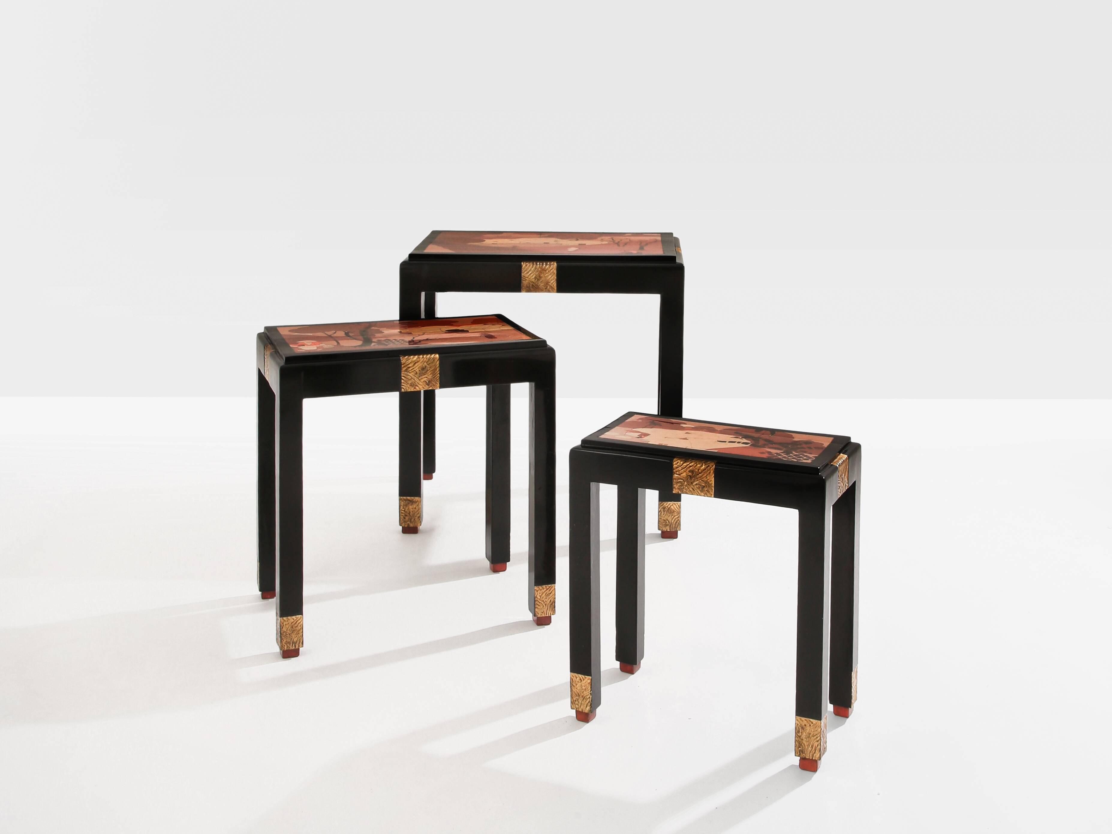 Set of three nesting tables with Asian decor, blackened wood, circa 1920.