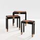 Set of three nesting tables with Asian decor, blackened wood, circa 1920.