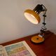 Articulated orange Aluminor desk lamp industrial design 70s