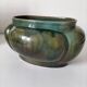 Art Deco lobed cache-pot in glazed turquoise earthenware.