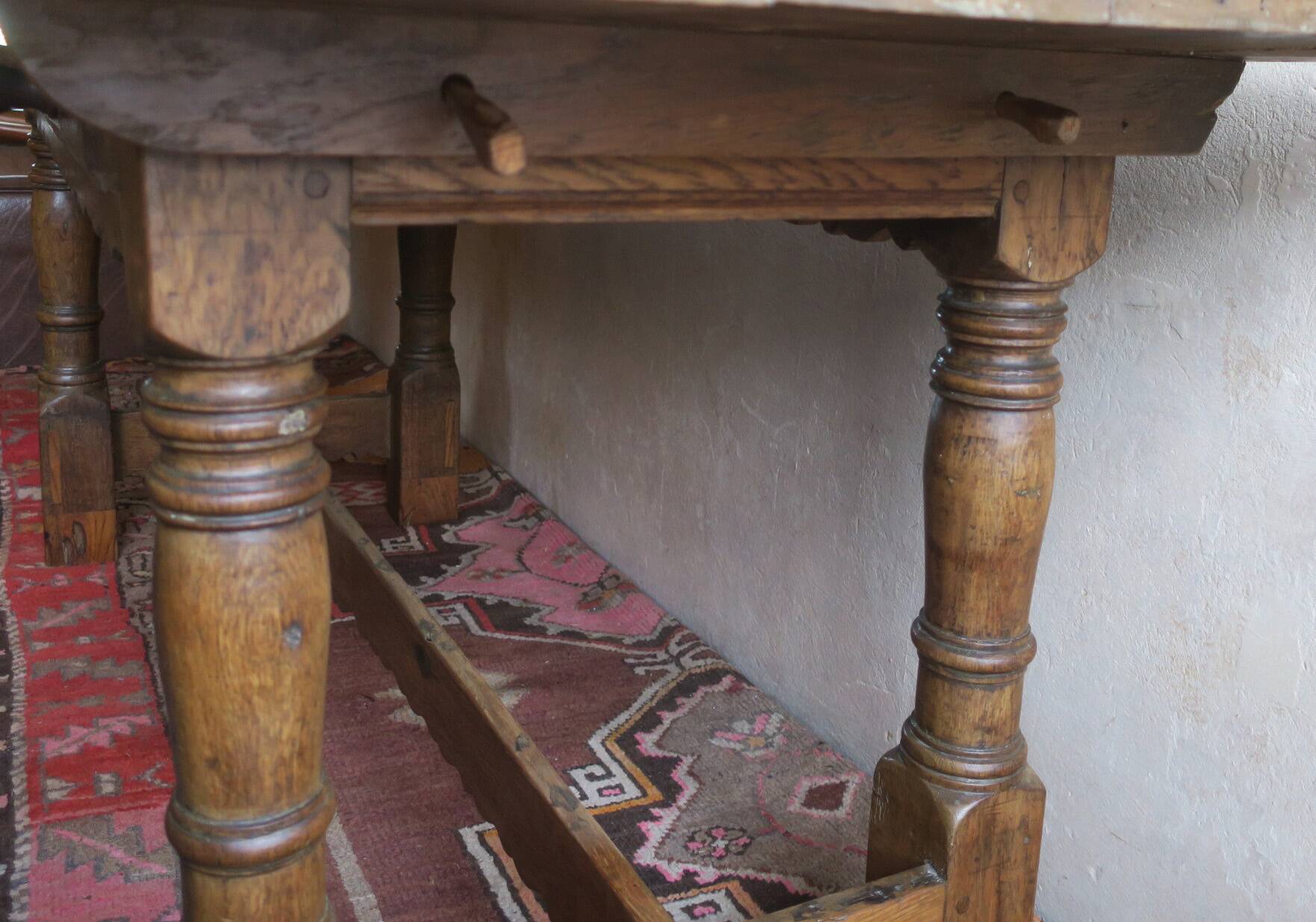 Antique patinated oak dining table, 18th century