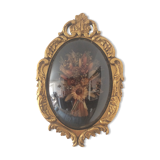 Golden wood frame and vintage bulging glass