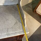 Antique wood and marble kitchen sideboard with carved backsplash