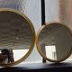 Suite of three brass mirrors