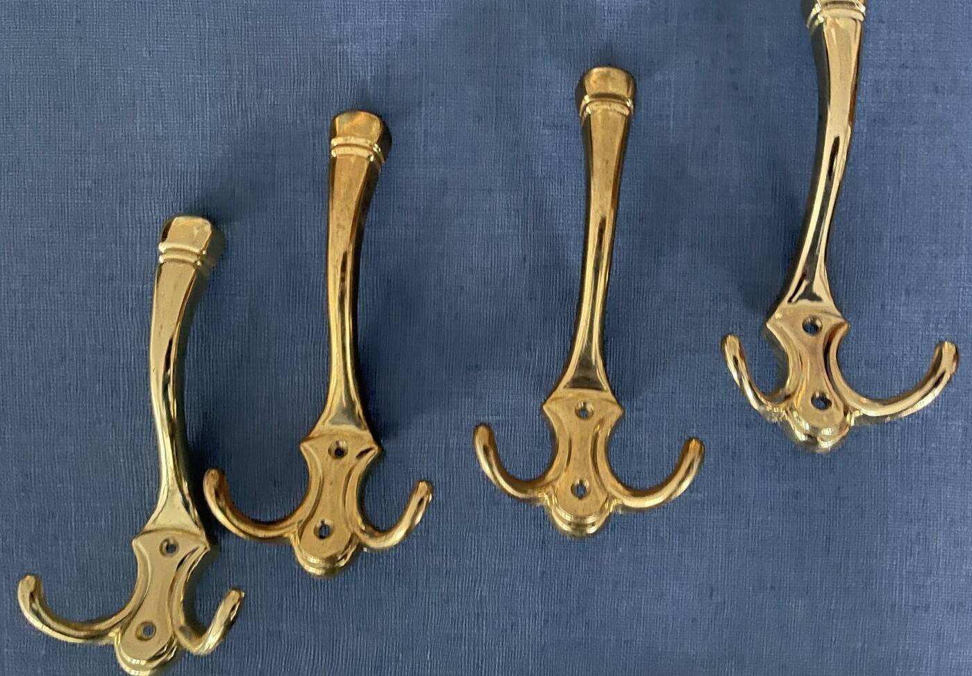 4 golden brass coat racks