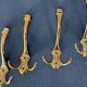 4 golden brass coat racks