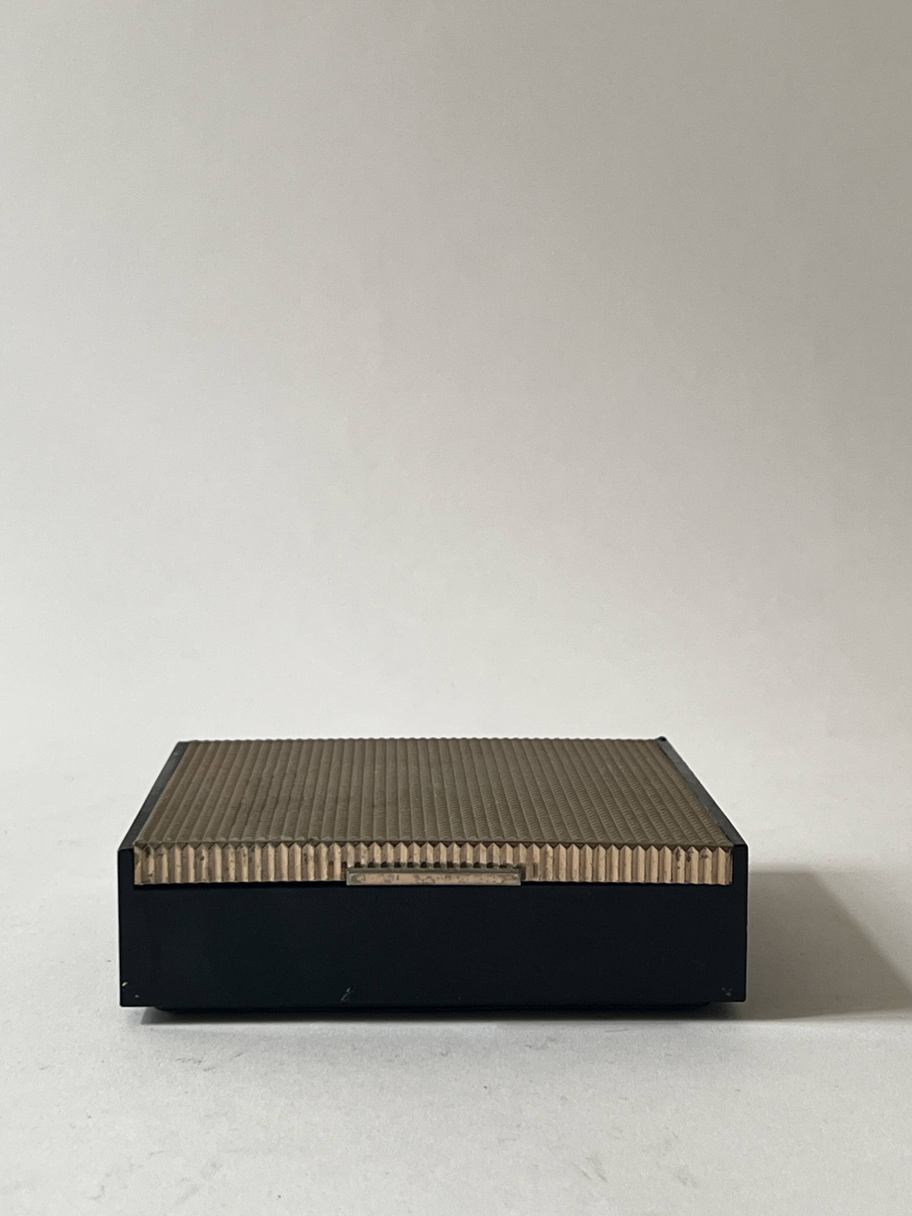 Bakelite and brass pocket emptier, 1970s design