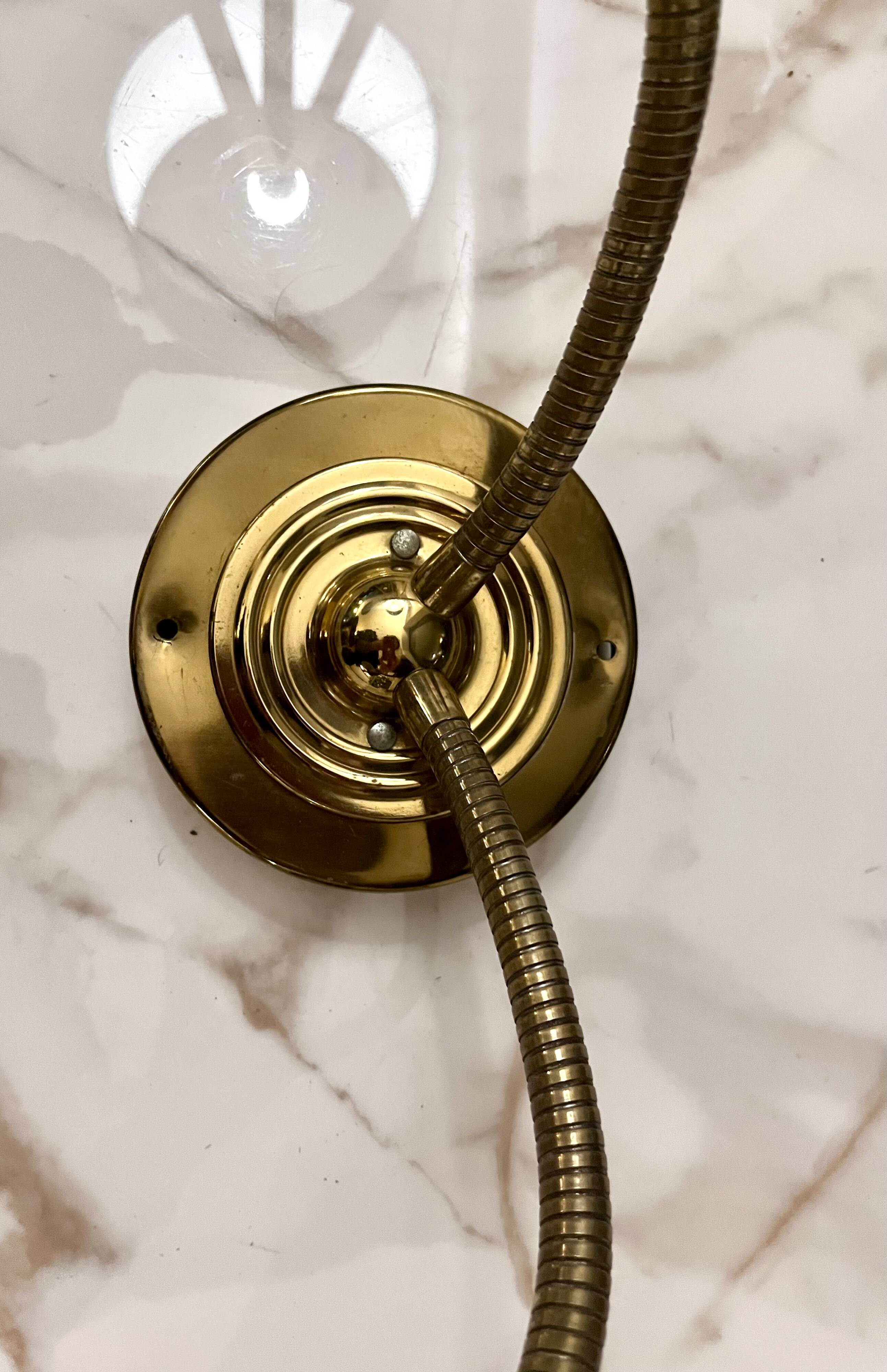 Articulated shell wall light
