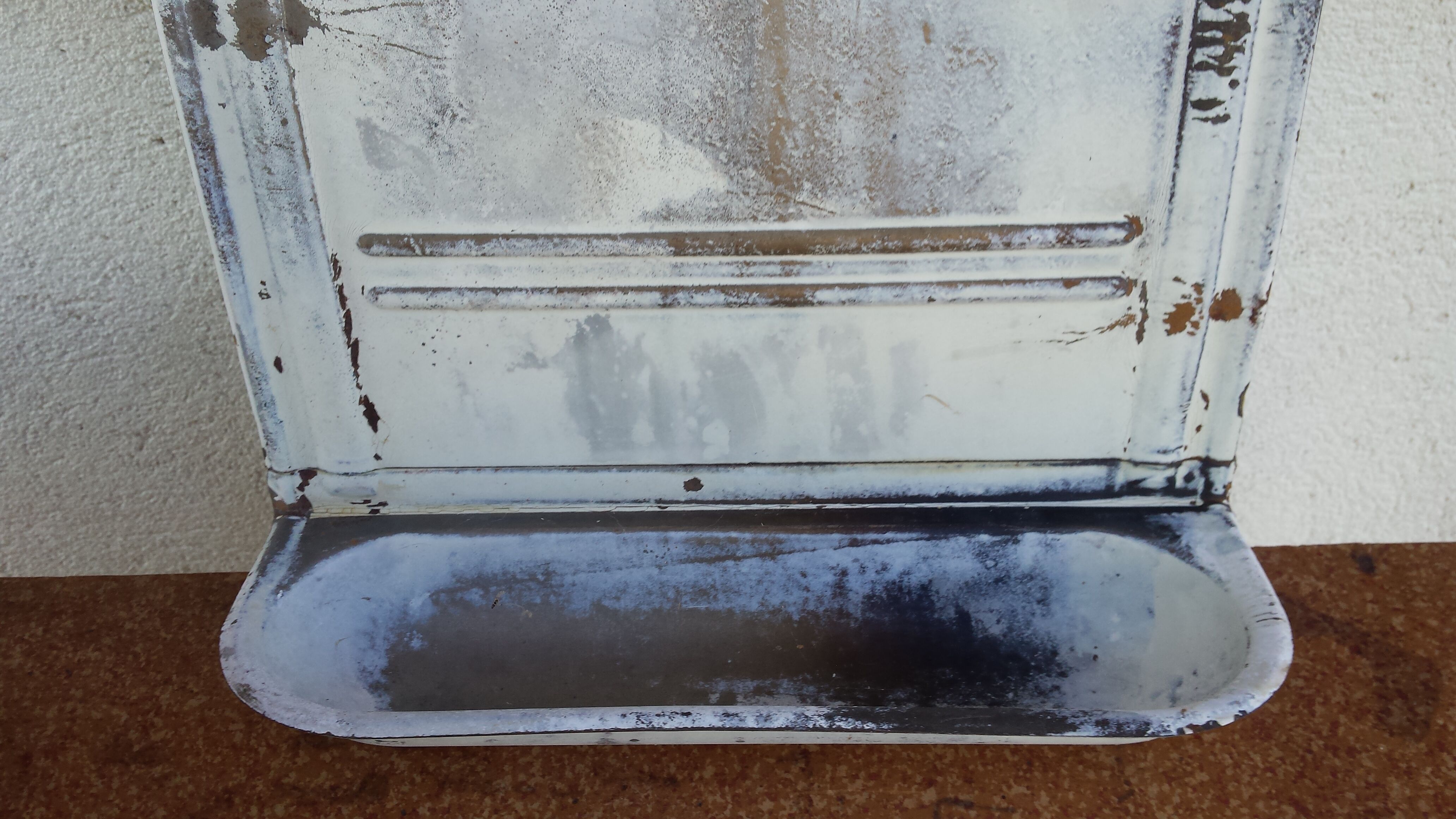 White ladle hangs with bowl