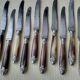 Box of 12 antique cheese or dessert knives. Steel and bovine horn.