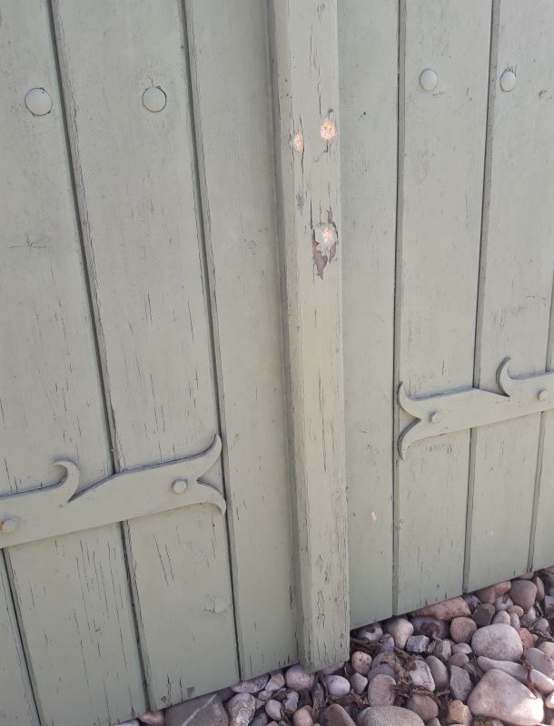 Pair of wooden shutters hanging iron