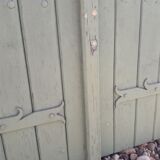 Pair of wooden shutters hanging iron