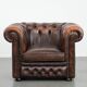 Brown Chesterfield armchair made of cowhide leather in English style