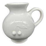 white ceramic cherry jug