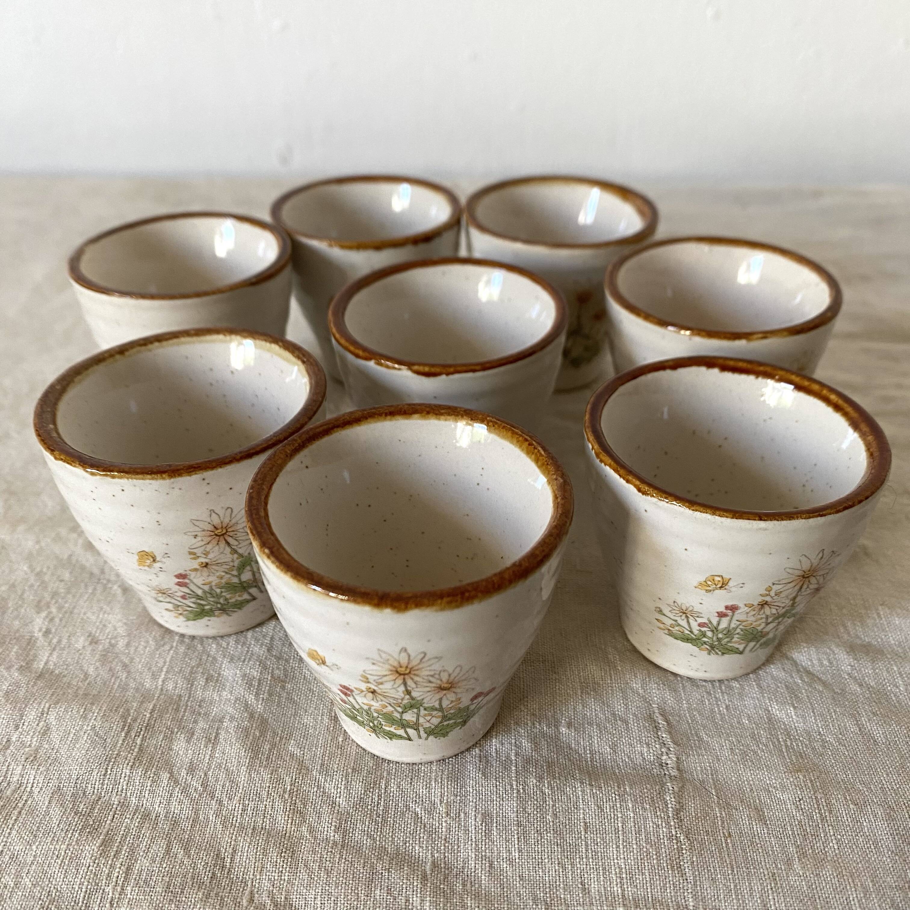 Stoneware egg cups, floral decoration
