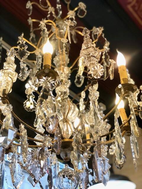 Large chandelier with tassels and old daggers