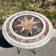 Round marble table with marble inlay