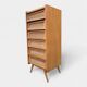 Vintage rattan chest of drawers with splayed legs from the 1950s.
