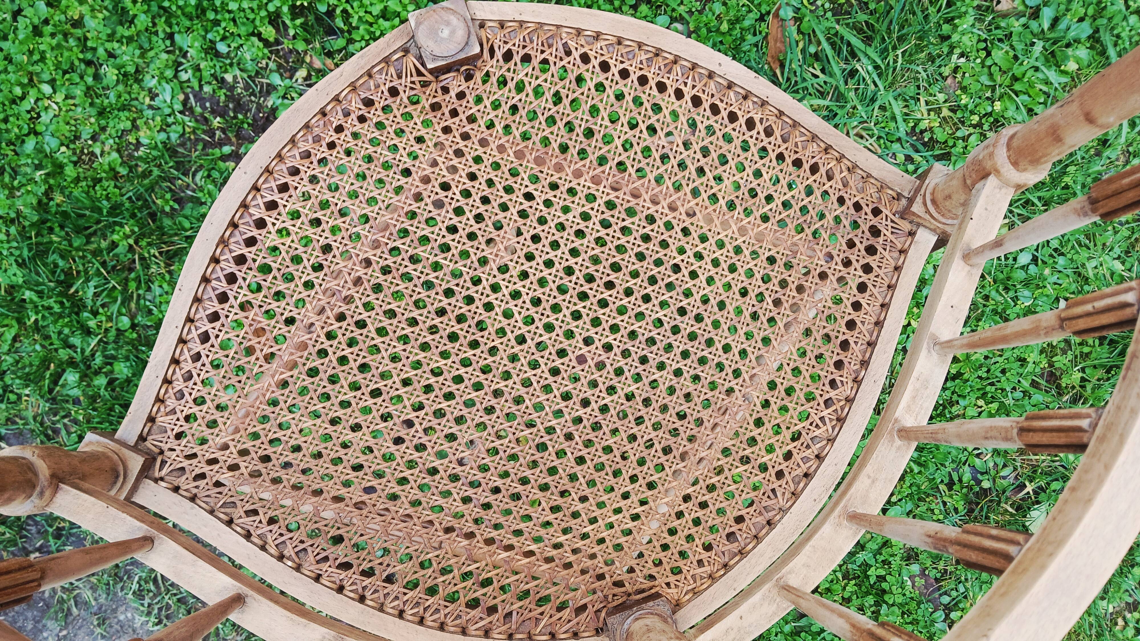 Corner chair in beech, caned seat from the early 20th century.