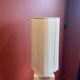 Beige marble stucco base, Houles white ecru fringed lampshade.