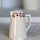 Vintage ivory earthenware milk jug with cherry pattern – Le Comptoir Pain d’Épices
