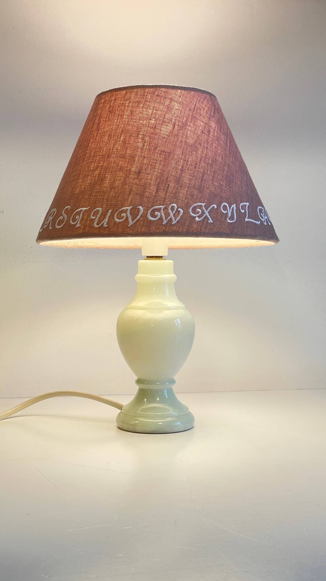 White marble lamp and vintage linen