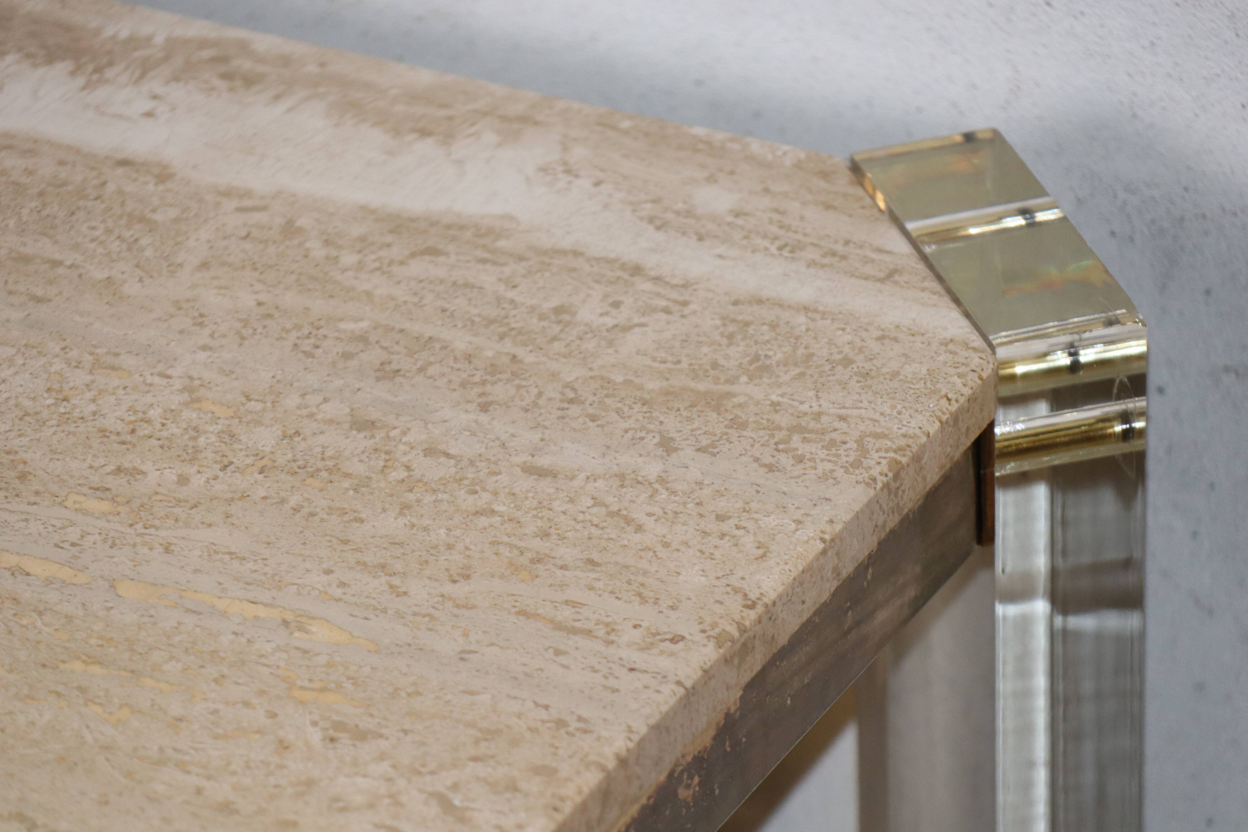 1970s dining table in travertine, gold metal and plexiglass.
