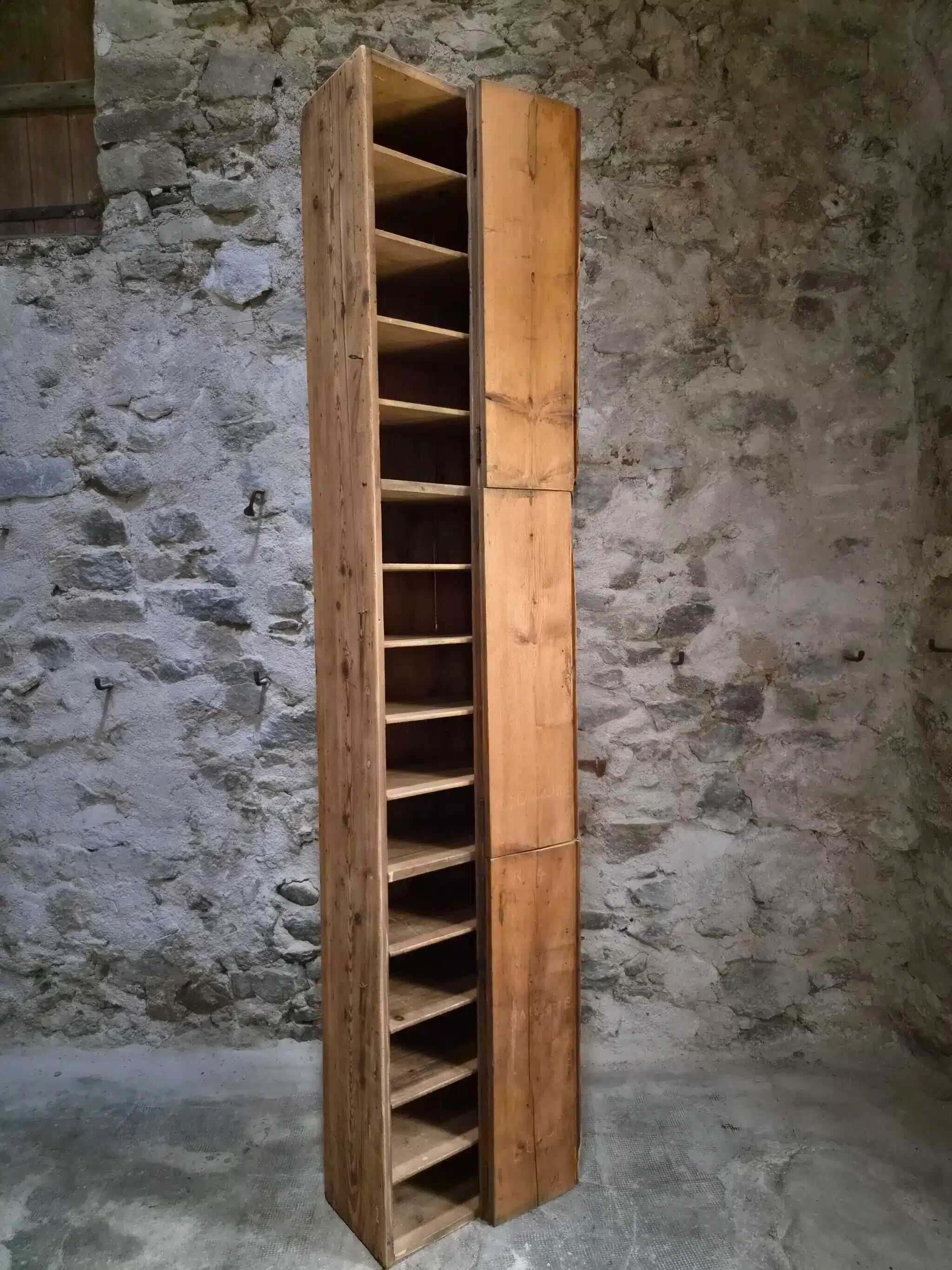 Antique French workshop cabinet in pine with compartments.