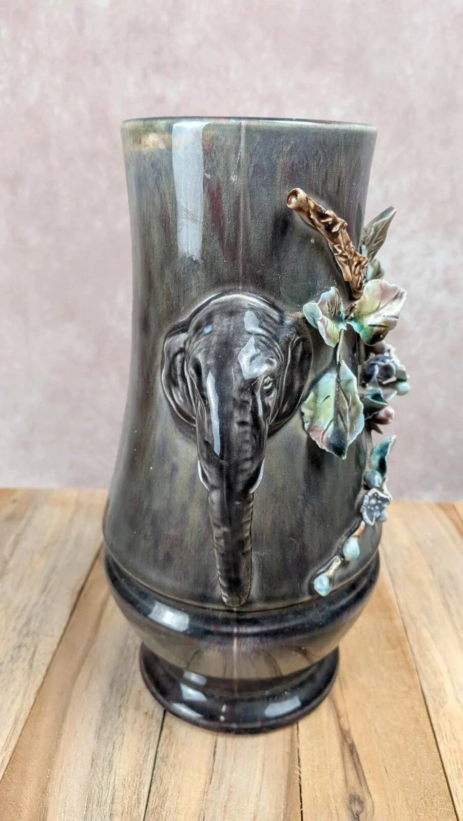 Antique vase in slipware with elephant and flower decoration.