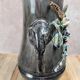 Antique vase in slipware with elephant and flower decoration.