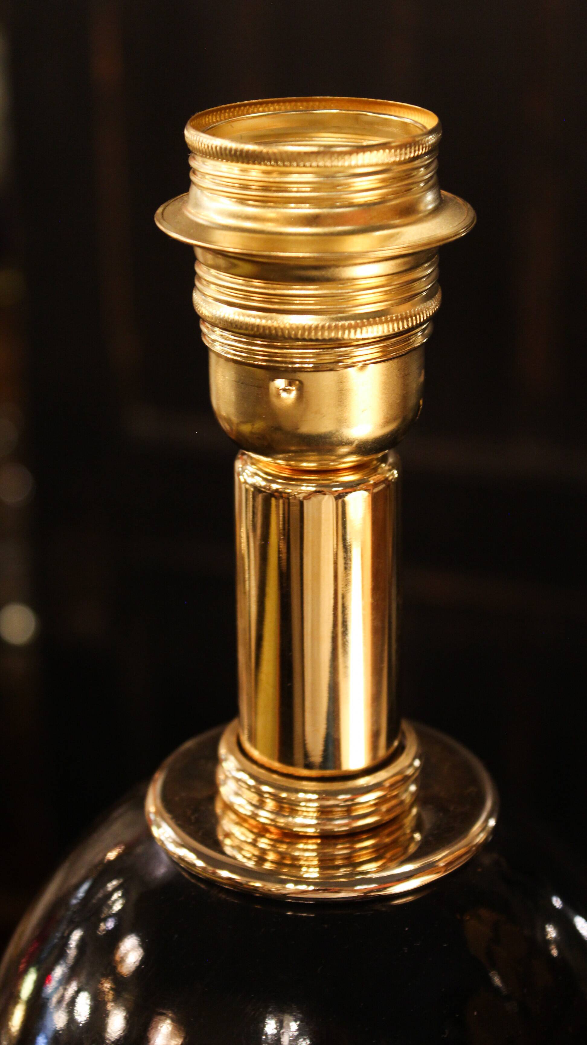 Black lamp in Hollywood Regency style