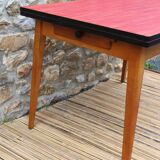 Extendable wooden and formica table