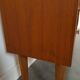 Deens teak vakkenkast met lades en hoge poten, vintage wandkast