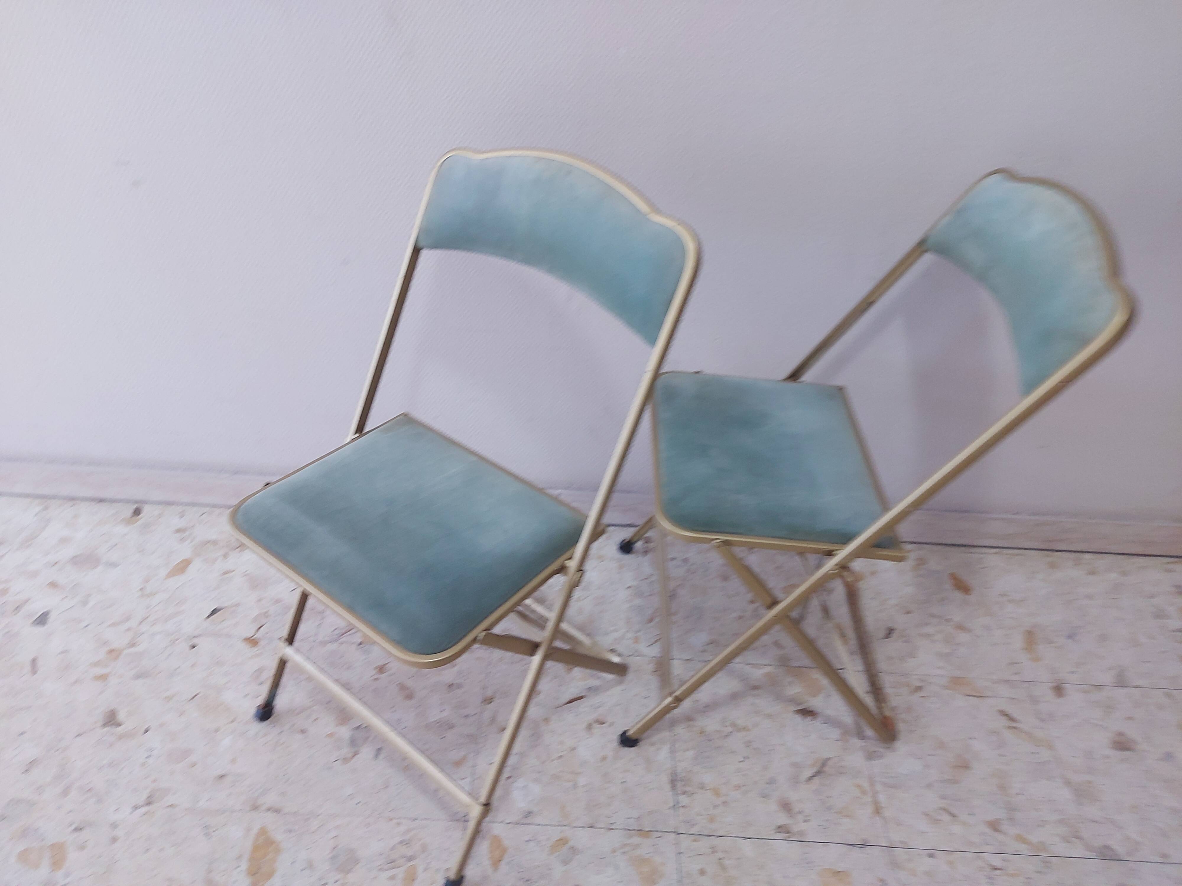 Two folding opera chairs in velvet
