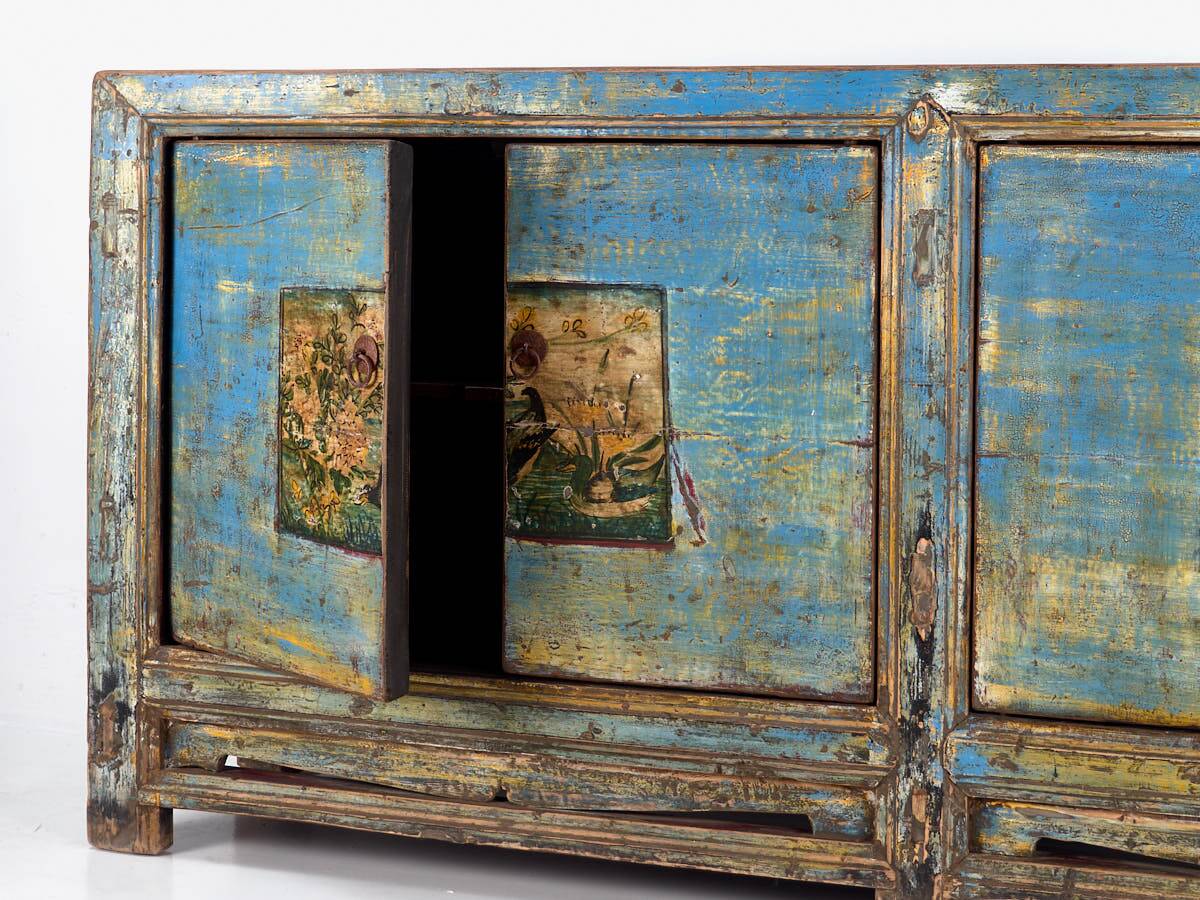 Old wooden entrance buffet in blue and yellow tones (circa 1920).