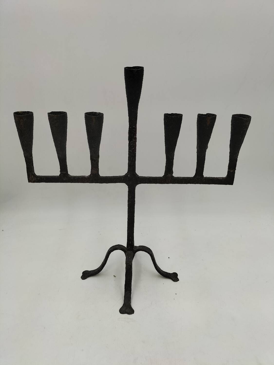 Brutalized wrought iron candle holder