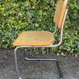 Wooden chair with caning in the style of Marcel Breuer.