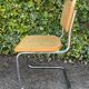 Wooden chair with caning in the style of Marcel Breuer.